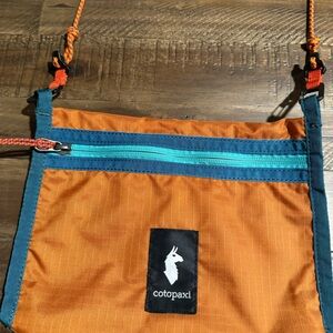 Cotopaxi Vibrant Orange and Teal Crossbody Bag. NWOT